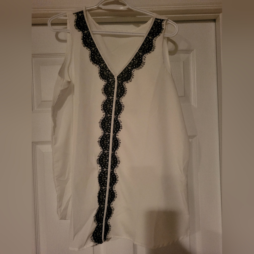Ricki's white blouse
